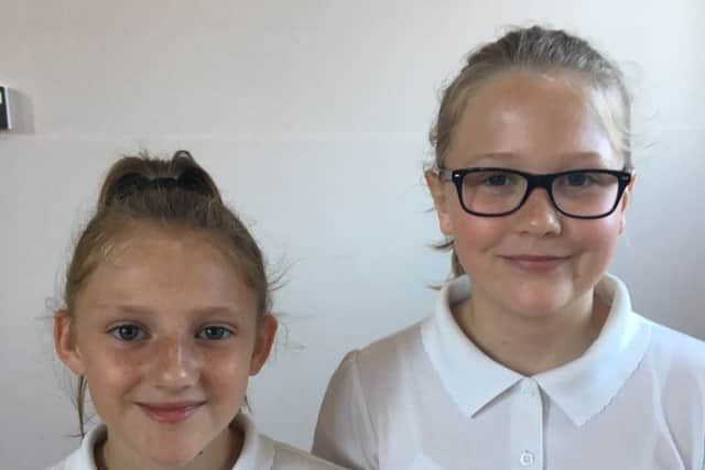 Brownlow Primary School pupils Skye Sanders and Polly Abbott, who wrote an article about retiring teacher Bridget Ingles EMN-191207-102650001