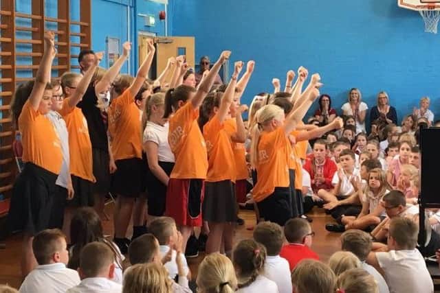 Pupils and staff at Melton's Brownlow Primary School pictured during a special assembly in memory of beloved former teacher Fred Parker, who passed away earlier this year EMN-190715-120001001