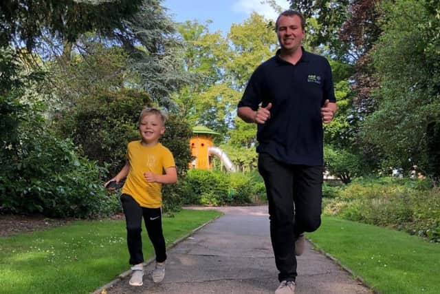 Rob Peet and son Christopher (5) run one of their golden miles for LOROS EMN-190715-153037001