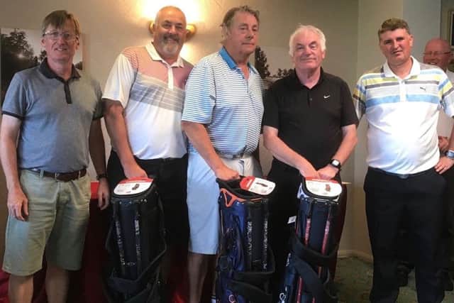 Melton GC vice-captain John Harvey (left) with the winning Edwalton GC team EMN-190716-122353002