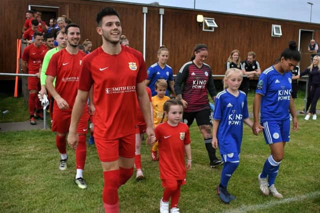 Cameron Gilchrist leads Melton out with mascots EMN-190717-141209002