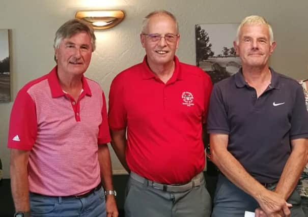 Pete Rayers and Brian Shilham, two-thirds of the winning team, with senior captain Dick Chapman (centre) EMN-190718-163110002