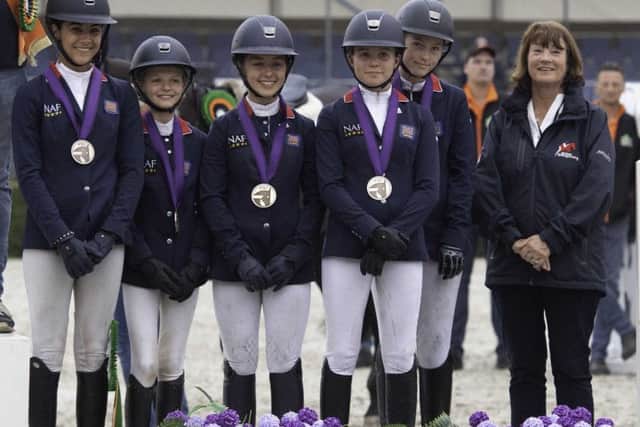Tabitha (second left) and team-mates wear bronze EMN-190718-172908002