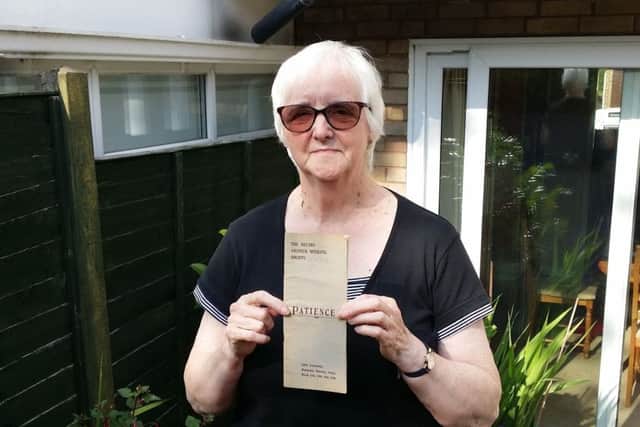 Marilyn Pepper, chair of The Melton Musical Theatre Company, with a programme from the group's first show in 1920 and some photos showing past productions EMN-190724-164558001