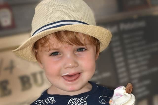 Two-year-old George Davies enjoys an ice cream as Melton swelters today in temperatures hitting the mid-30s EMN-190725-145815001