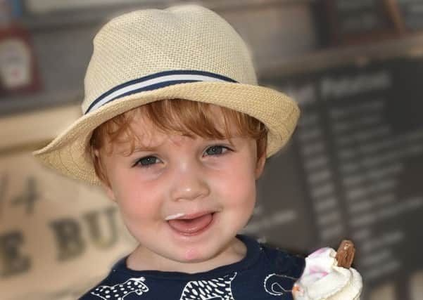 Two-year-old George Davies enjoys an ice cream as Melton swelters today in temperatures hitting the mid-30s EMN-190725-145815001