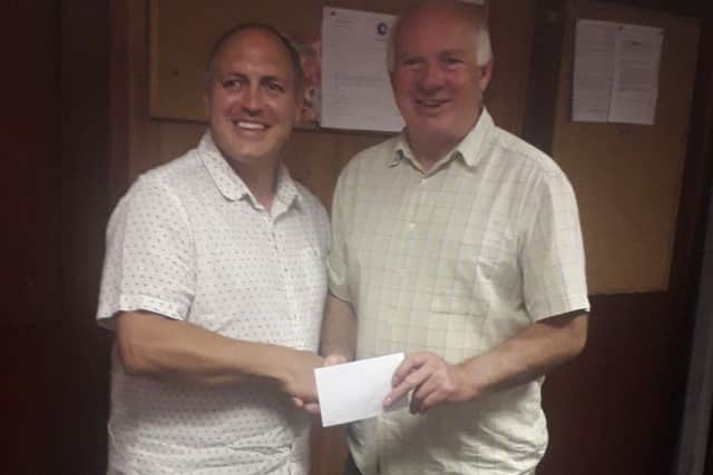 Richard Auciello (left), of Voluntary Action Rutland, with Melton Charity Cup chairman Gordon Wells EMN-190731-113243002