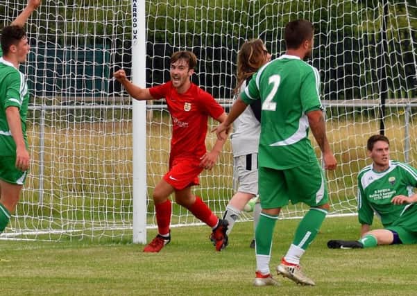 Munton celebrates his first goal for Melton as he slots the hosts' opening goal of the season EMN-190508-103736002