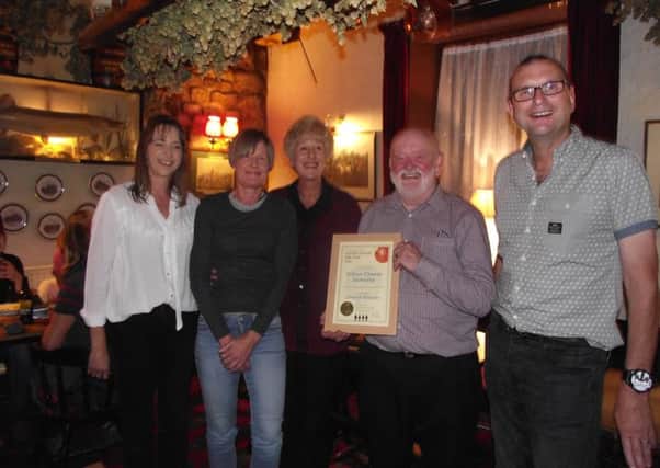 Melton CAMRA chairman Kevin Billson (right) presenting the award to landlords Jeff and Carol Evans and their daughters Lynn and Claire at a special celebration evening attended by a large group of members and some of the pubs locals PHOTO: Supplied