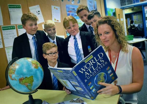 Long Field Academy teacher, Jenny Turner, Melton's first 'climate change teacher', goes over some points with pupils EMN-190309-154257001