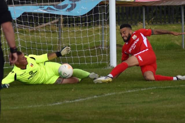 Nathan Arnold attempts to net the rebound after Swarles saved the second of Town's four penalties EMN-190909-163106002