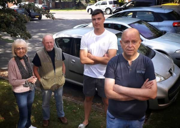 Brian Ellis with other disgruntled residents who are fed up with motorists using their car park on Chapel Street, Melton EMN-190918-105440001