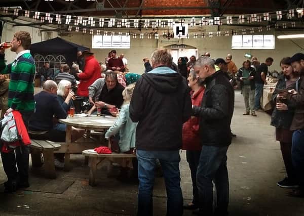 Real ale and cider fans pack out the Market Tavern at a beer festival in 2017 PHOTO: Tim Williams EMN-190917-171746001