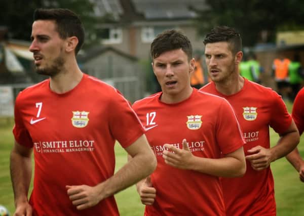 Tom Harris (centre) and Chris Hibbitt scored half of Melton's tally at Thurnby EMN-190925-102158002
