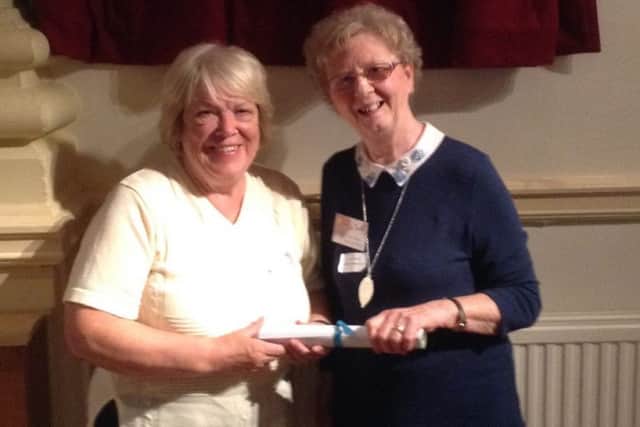 Melton in Bloom chair Sue Herlihy and committee member Lucy Wood collecting the town's East Midlands in Bloom Silver-Gilt Award PHOTO: Supplied