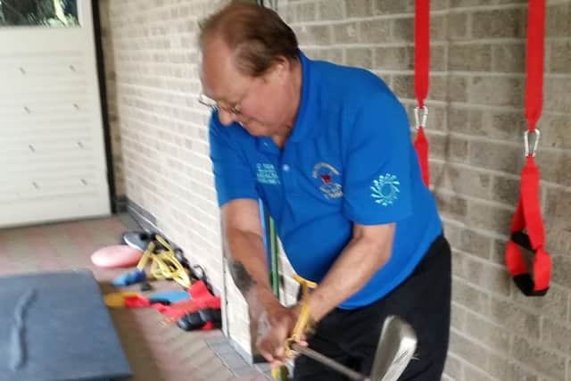 Don Povey practices swinging a golf club again EMN-190920-124139001