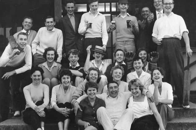 The late Norman Carroll pictured (on the left holding a bat over his shoulder) with fellow members of the Peterborough Evening Telegraph cricket team, work colleagues and supporters around 1960 EMN-190924-103032001