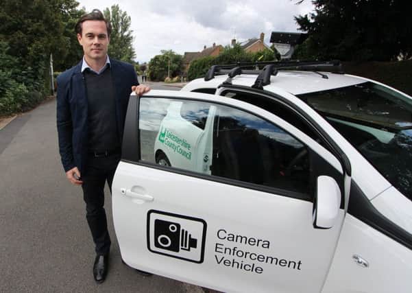 Councillor Blake Pain with the camera enforcement vehicle being used by Leicestershire County Council to clamp down on motorists who park irresponsibly outside schools EMN-190924-160519001
