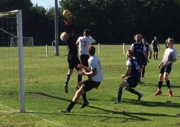 Rhys Hill challenges the Coalville keeper EMN-190924-172022002
