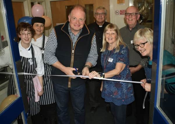 Radio Leicester's Ben Jackson cuts the ribbon with centre manager Linda Abbott at the Mary's Place relaunch EMN-190925-113826001