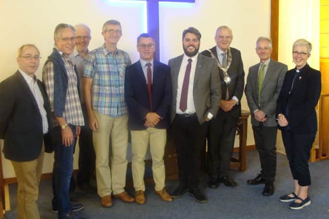 Melton Mowbray Baptist Church's new minister, the Rev Sam Dunn (fourth from the right) pictured at his induction service with his father, Rev Graham Dunn, the Mayor of Melton, Councillor Malise Graham, plus East Midlands Baptist colleagues and ministers of Melton churches EMN-190926-151610001