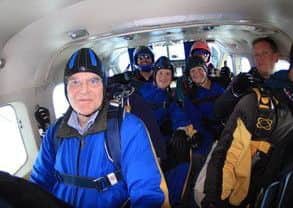 Mayor of Melton, Councillor Malise Graham, pictured in the plane as he prepares to do his charity parachute jump with family members EMN-190927-120920001