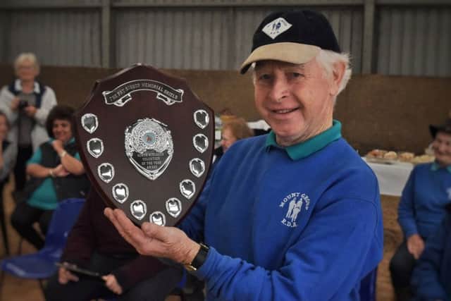 First recipient of the Pat Bishop Volunteer of the Year award, Albert Rutledge, with the shield presented by the RDA Mount Group at their Somerby Equestrian Centre base EMN-190110-122032001