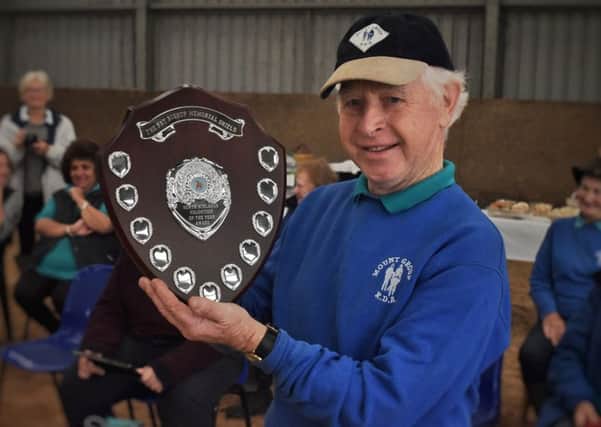First recipient of the Pat Bishop Volunteer of the Year award, Albert Rutledge, with the shield presented by the RDA Mount Group at their Somerby Equestrian Centre base EMN-190110-122032001