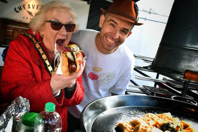 Chairman of Leicestershire County Council Pam Posnett with Tomasz Fatyga at the Polish Heavenly Sausage stand PHOTO: Tim Williams