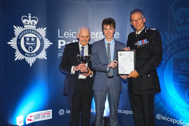 Melton Volunteer Police Cadet Finley ORiordan receives his award as Leicestershire Polices Cadet of the Year with Chief Constable Simon Coles (right) and award sponsor David Saville EMN-190410-162215001