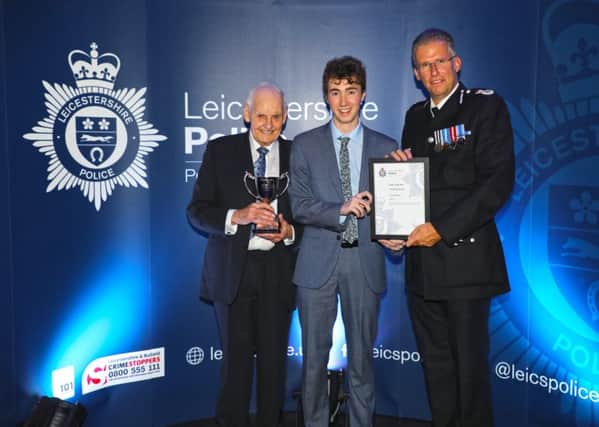 Melton Volunteer Police Cadet Finley ORiordan receives his award as Leicestershire Polices Cadet of the Year with Chief Constable Simon Coles (right) and award sponsor David Saville EMN-190410-162215001