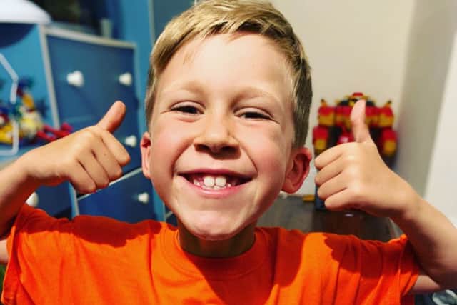 CJ Wood (7) who is taking on a cycling challenge for the MS Society to help sufferers like his dad EMN-190710-130440001
