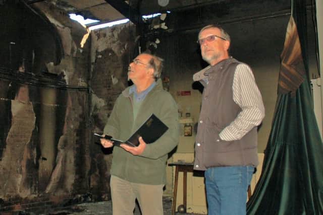 Chairman Brian Keevil and treasurer Ian Smith inspect the fire damage at Hose village hall a year ago EMN-190910-162042001