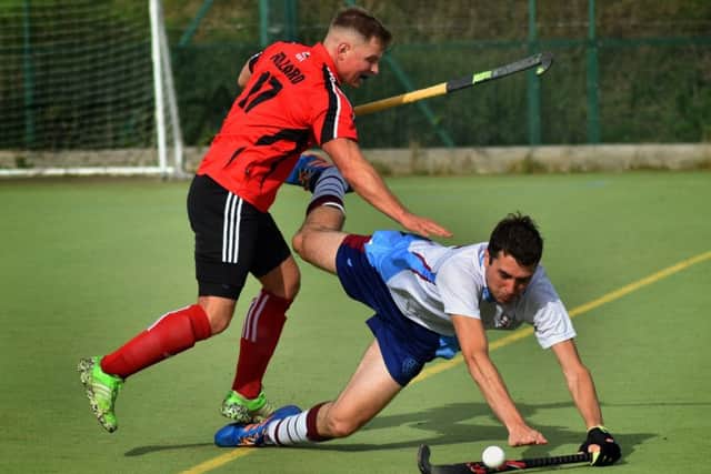 Sam Pollard comes off better from a collision with an opponent EMN-191015-123521002