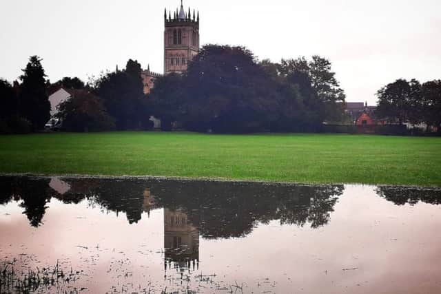 Flood waters on parkland in the shadow of Melton's St Mary's Church, captured this week by our photographer Tim Williams EMN-191015-132353001