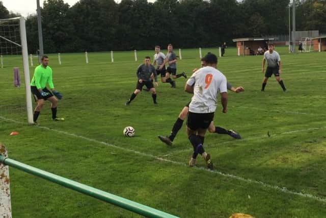 Linford Harris lays the ball back across the Falcons box EMN-191015-150551002
