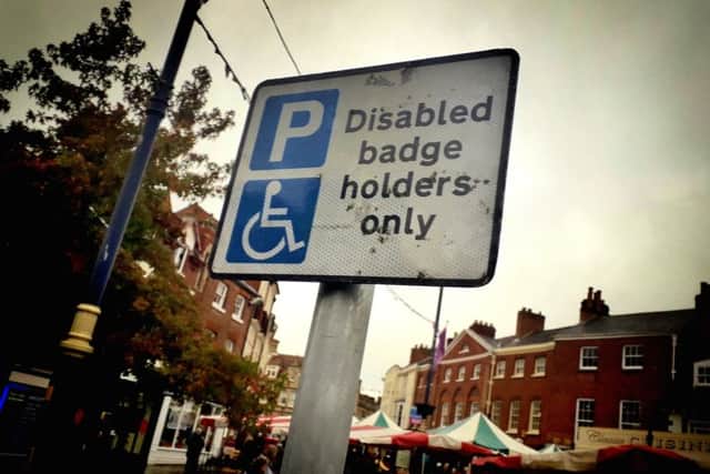 A sign showing a disabled parking space in Melton town centre EMN-191015-162605001