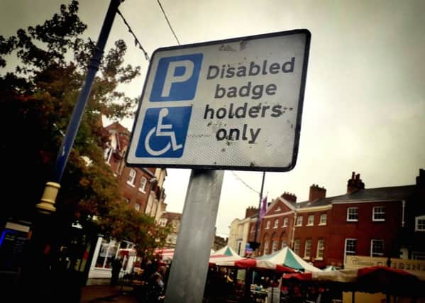A sign showing a disabled parking space in Melton town centre EMN-191015-162605001