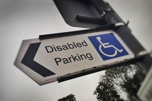 A sign showing a disabled parking space in Melton town centre EMN-191015-162628001
