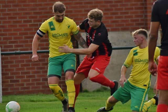 Luke Peberdy holds on to possesion against Whitworth EMN-191016-120035002