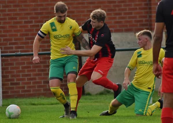 Luke Peberdy holds on to possesion against Whitworth EMN-191016-120035002