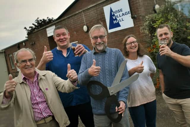 Villagers and committee members celebrate the newly-renovated Hose Village Hall being re-opened a year after a devastating fire EMN-191022-094328001