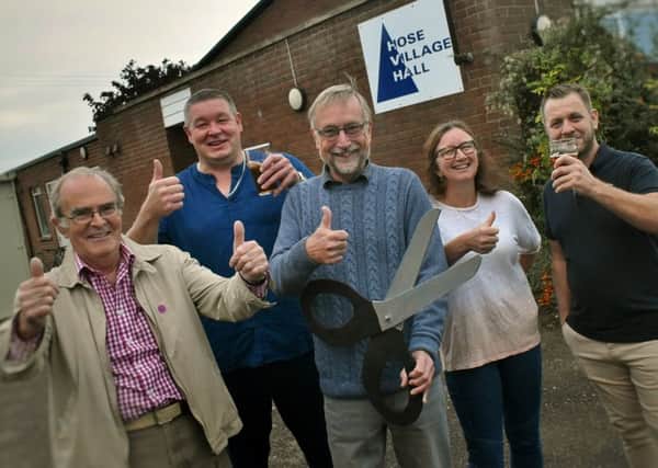 Villagers and committee members celebrate the newly-renovated Hose Village Hall being re-opened a year after a devastating fire EMN-191022-094328001