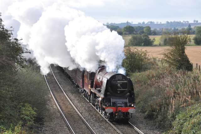 A steam hauled express train hauled by former LMS pacific 6233 Duchess of Sutherland pictured between Langham and Ashwell as it powered its way to Melton staion en route to York
PHOTO PAUL DAVIES EMN-191022-101059001