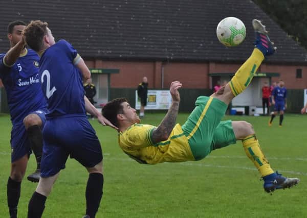Holwell goalscorer Aiden Black tries an audacious overhead kick EMN-191023-092018002