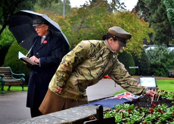 Major Carolyn Bates representing the Defence Animal Training Regiment plants a crossat the Memorial Gardens during a service to launch the 2019 Poppy Appeal in Melton EMN-191029-151743001