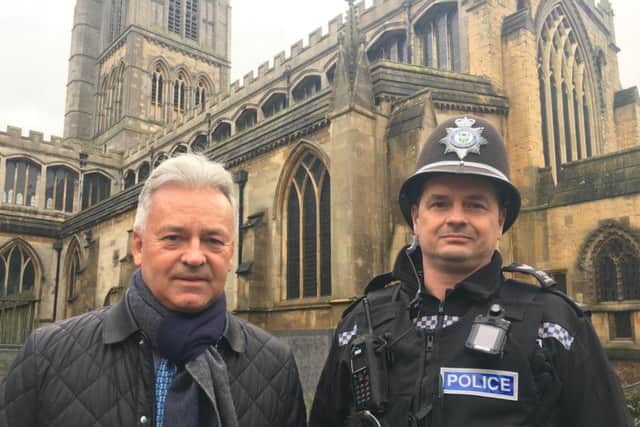 Melton MP Sir Alan Duncan pictured with Sgt Iain Wakelam, of Melton Police, outside St Mary's Church in the town in January this year, as they discussed concerns over rising crime EMN-191030-160348001