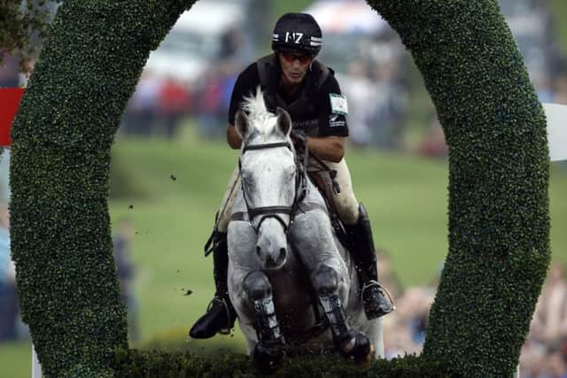 New Zealand's Andrew Nicholson riding Avebury competes in the cross-country phase during day three of the 2014 Land Rover Burghley Horse Trials a: Steve Parsons/PA Wire