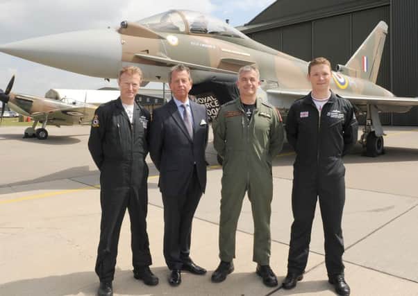 RAF unveils 'Battle of Britain' Tyhoon fighter jet to commemorate the 75th anniversary of Battle of Britain. It was also painted with the 249 squadron ID number of the only Fighter Command pilot awarded with a Victoria Cross, Flight Lieutenant James Brindley Nicolson VC DFC. L-R Flight Lieutenant Antony Parkinson MBE, Jim Nicolson - relative of James Brindley Nicolson, Wing Commander James Heald, and Flight Lieutenant Ben Westoby-Brooks.