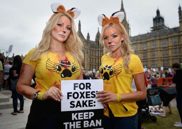 Anti-foxhunting protesters, Victoria Eisermann, former model (left) and Pola Pospieszalska, Polish pop singer (right) gather outside the Houses of Parliament, London. Photo: Anthony Devlin/PA Wire ENVIRONMENT_Foxhunting_122992.JP